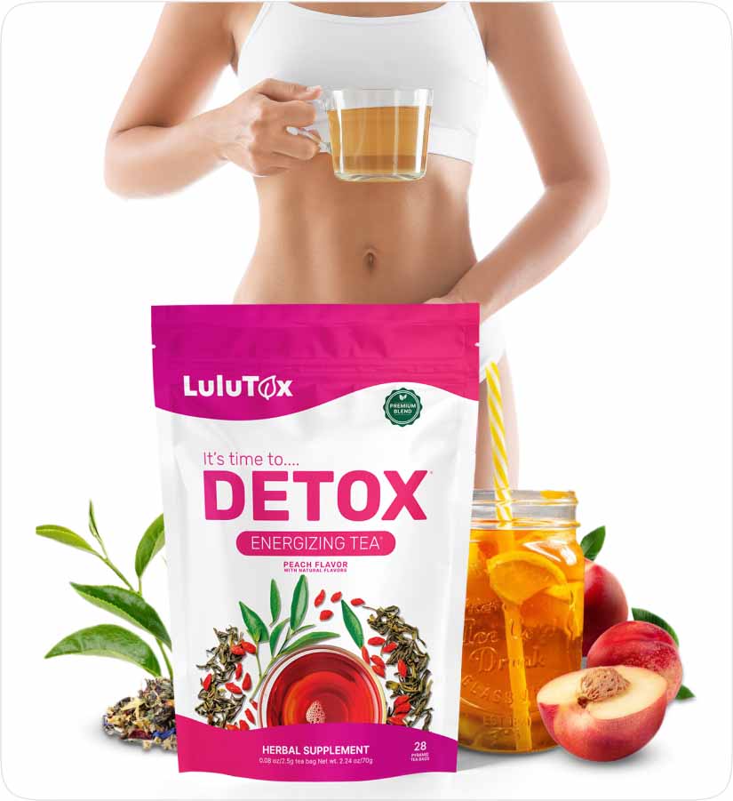 Hand holding glass cup of tea with Lulutox Detox Tea package peach flavor